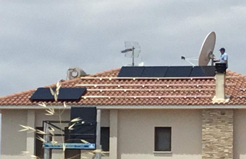 Solar PV panels being installed on a house in Dali