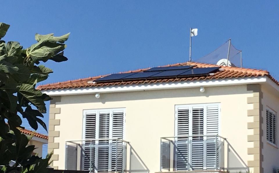 Solar PV panels on a villa roof in Paralimni